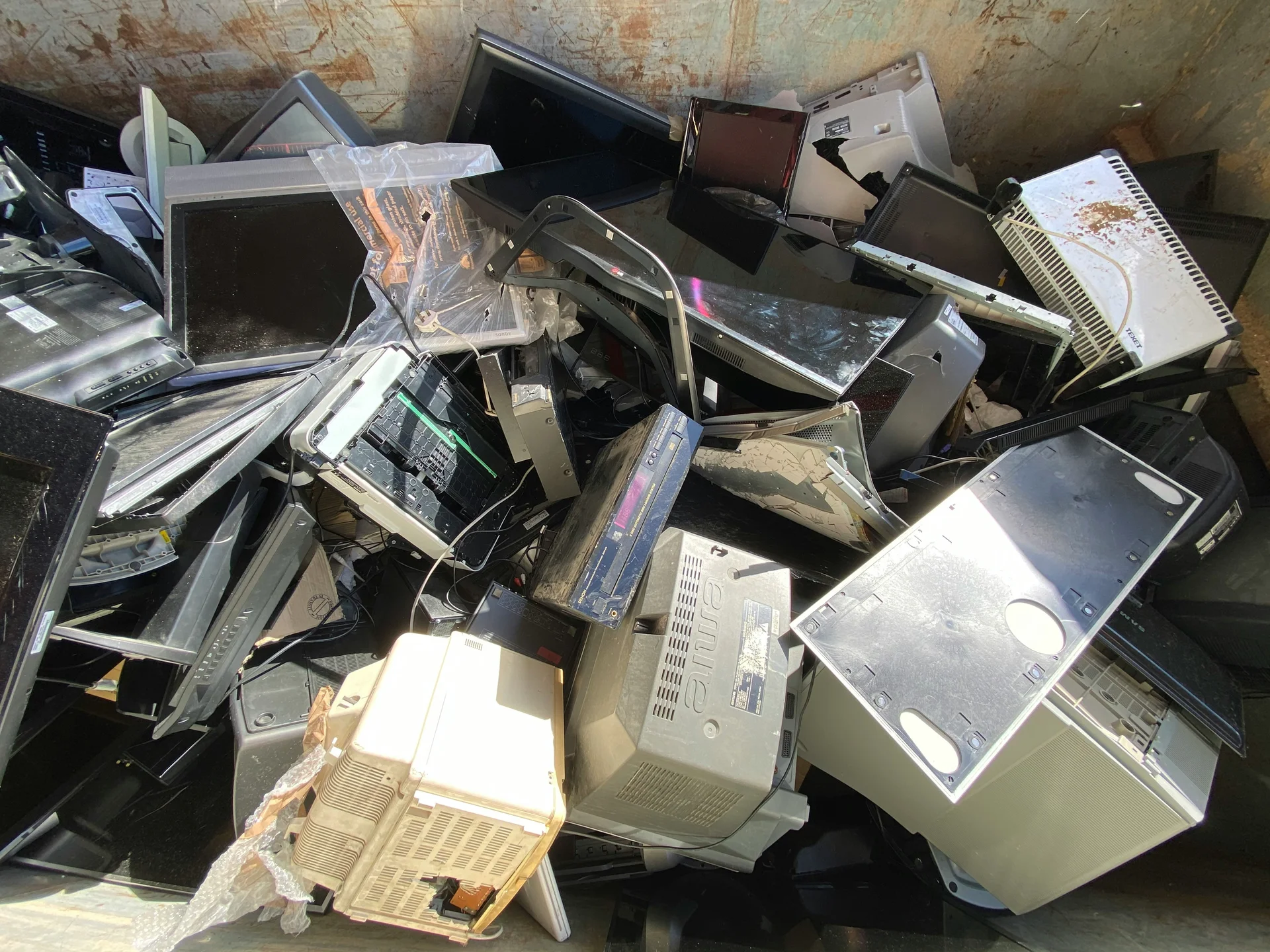 Stack of discarded computers and electronics prepared for recycling