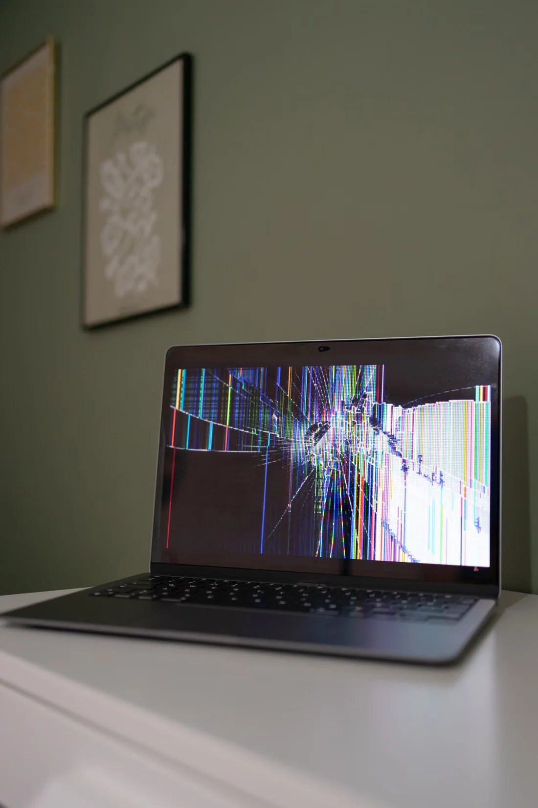 Faulty and damaged laptop with broken display for commercial laptop assessment